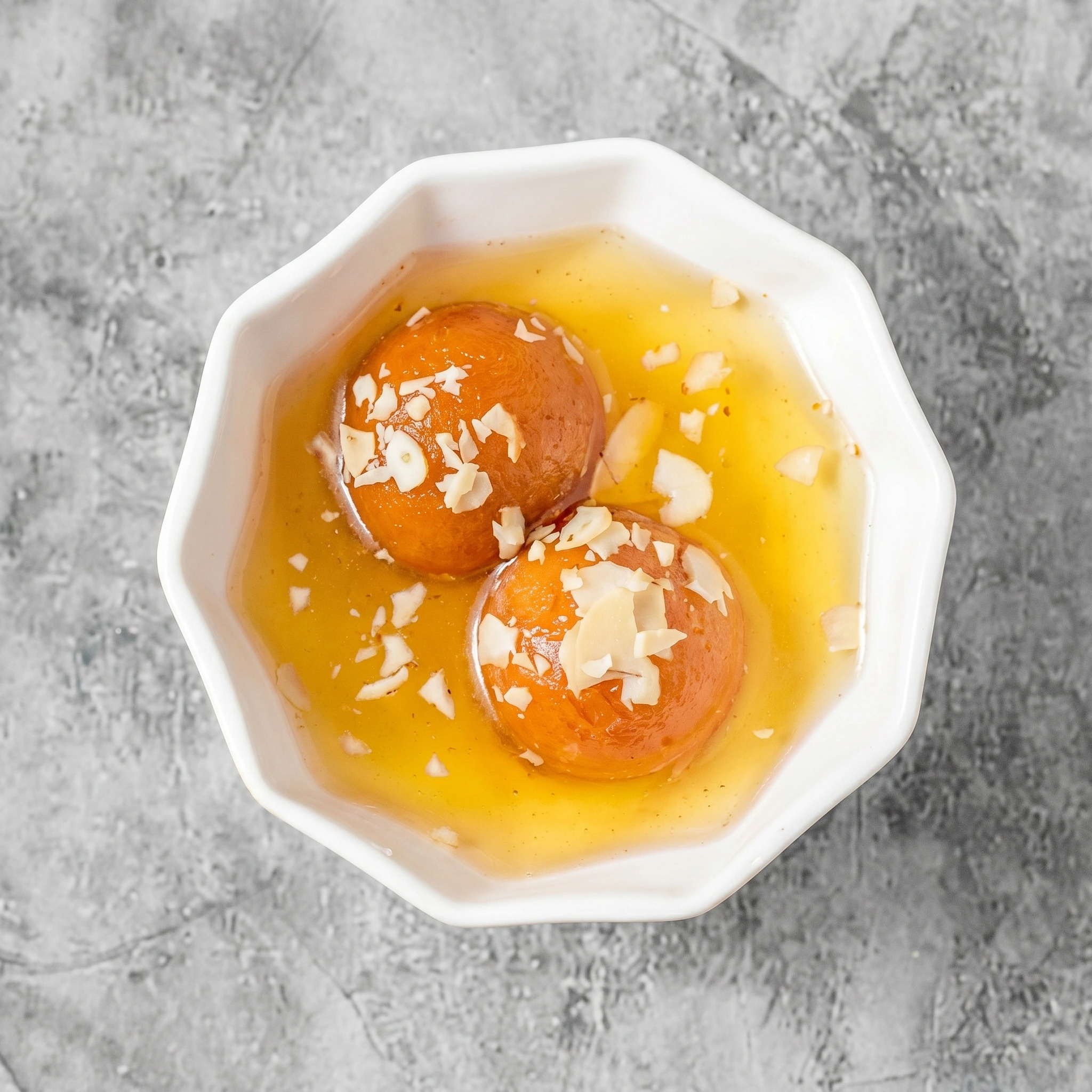 Warm gulab jamun dessert at Chatkhara The Curry House in Edmonton, AB